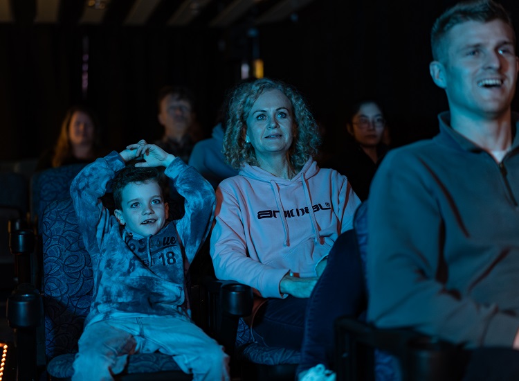 Monther and son watch a movie onboard Interislander