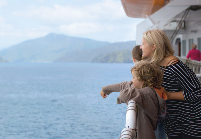 Mother and child looking out over the ocean from Interislander ferry