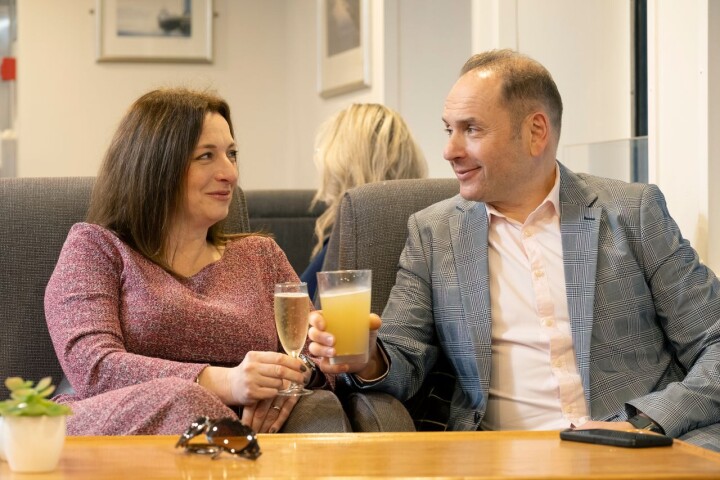 Premium Lounge Couple Enjoying Drinks